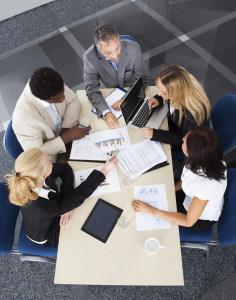 Group Of Businesspeople Discussing Together