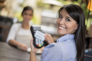 Woman making a contactless payment